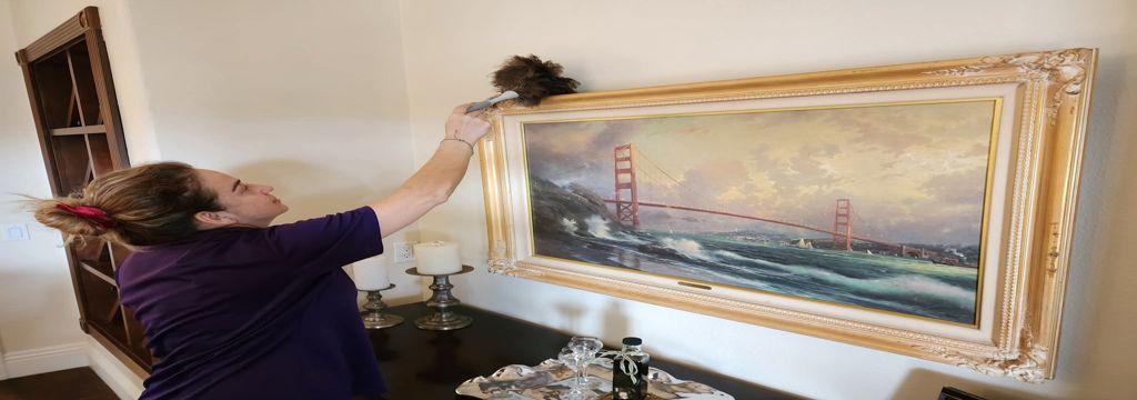 A picture of our staff cleaning frames